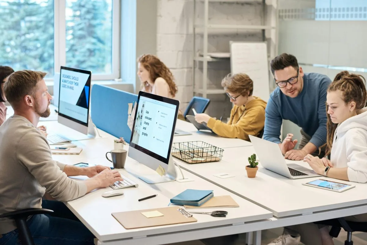 Practice team working at reception computers supported by Netbus
