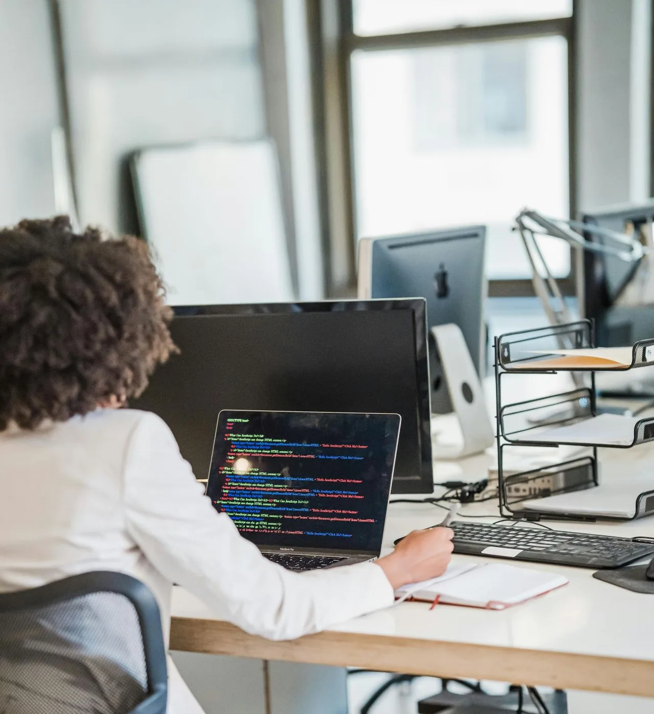 Remote worker at a laptop in a home office set up by Netbus